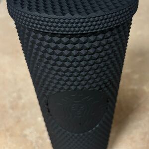 The Starbucks Matte Black Soft-Touch Bling Cold Cup combines sleek, matte black